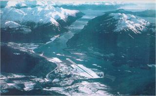 The above photo shows the Juneau International Airport and Gastineau Channel. The patches of churning water seen in multiple areas of the channel give an indication of the strength of the northerly wind conditions and turbulence that planes can expect to encounter when flying along the waterway. (Photo credit: John "Jack" Hermle).