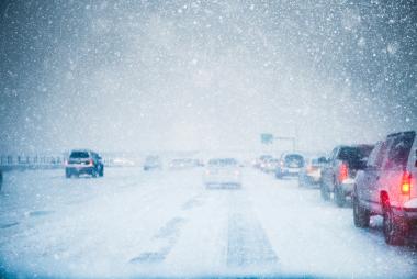 snowy highway with heavy traffic